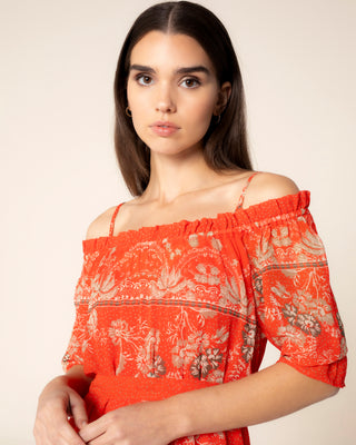 Imagen promocional de vestido estampado naranja manga larga zinnia