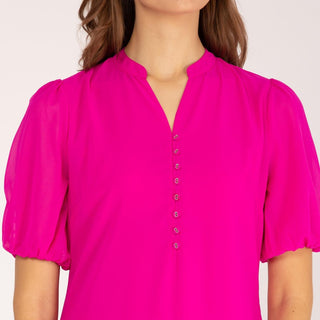 Vestido corto con volantes rosa